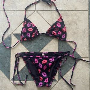 Victoria’s Secret black with kisses bikini. Extra small top extra small bottom.